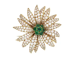 A yellow gold diamond and emerald Marguerite/Daisy Brooch. Van Cleef et Arpels, 1950 c.a.