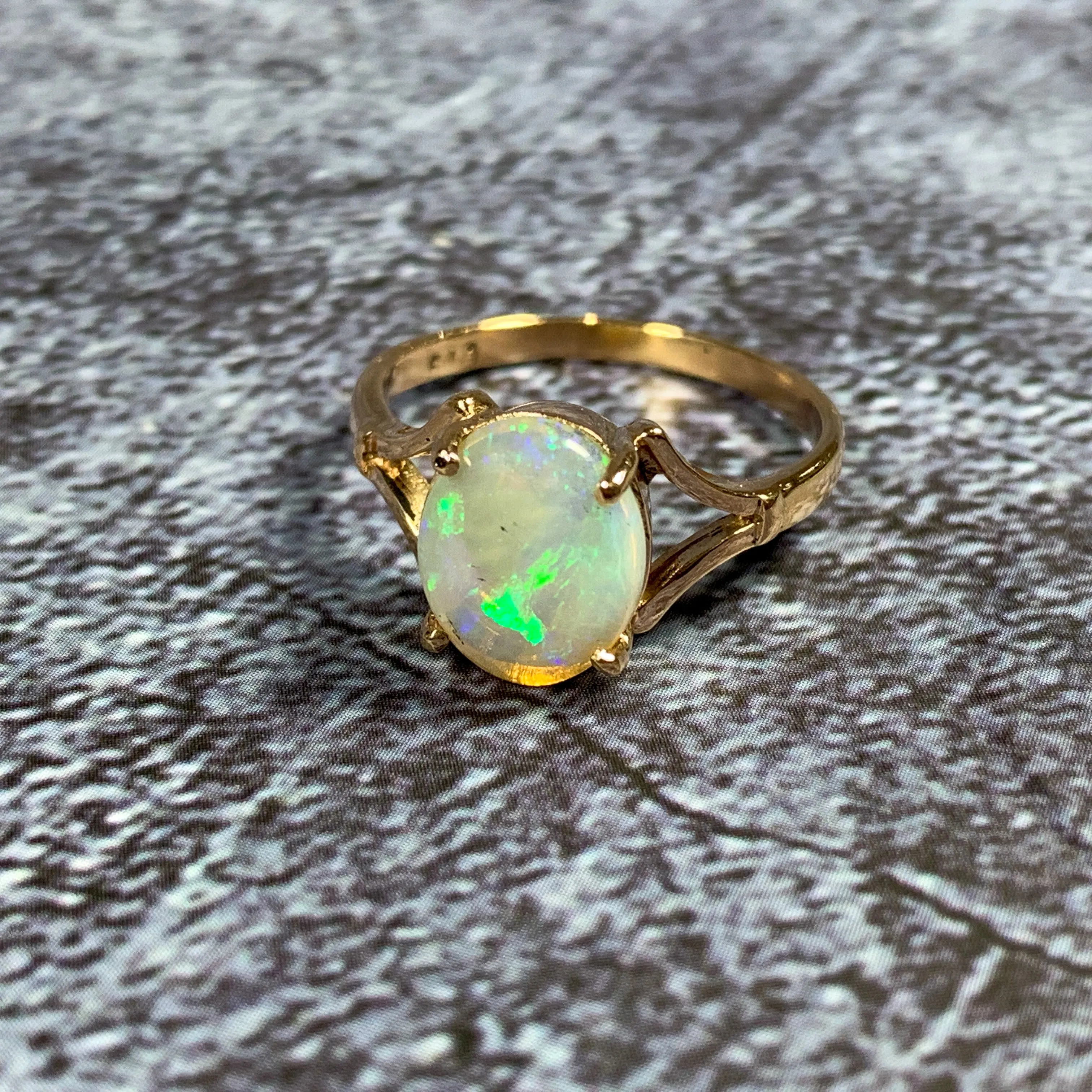 One 9kt Rose Gold solitaire ring set with one Green Blue Light Opal 1.49ct