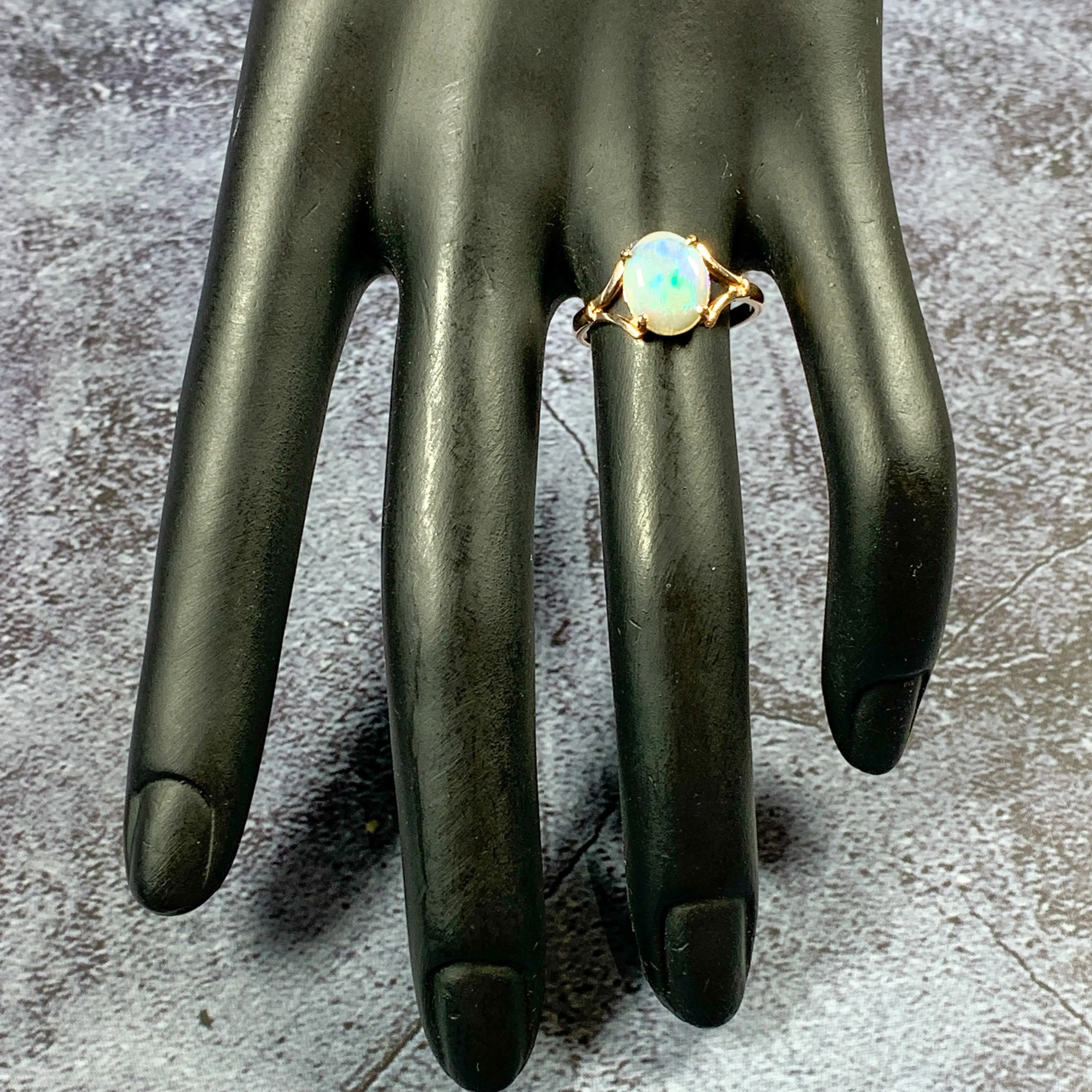 One 9kt Rose Gold solitaire ring set with one Green Blue Light Opal 1.49ct